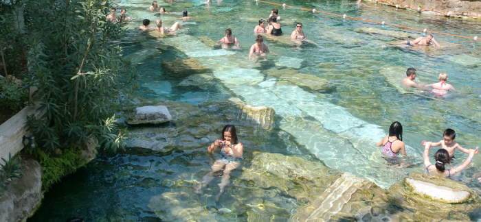 Cleopatra's antique thermal pool with fallen Roman columns, Hierapolis Cleopatra's antique thermal pool with fallen Roman columns, Hierapolis