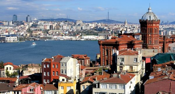 The red-brick Phanar Greek Orthodox College rising above the rooftops of Fener, with the Golden Horn and the city beyond The red-brick Phanar Greek Orthodox College rising above the rooftops of Fener, with the Golden Horn and the city beyond
