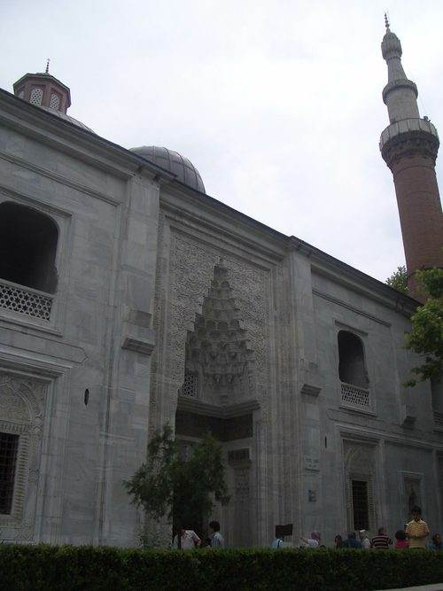 The carved marble portal and minaret of the Green Mosque in Bursa The carved marble portal and minaret of the Green Mosque in Bursa